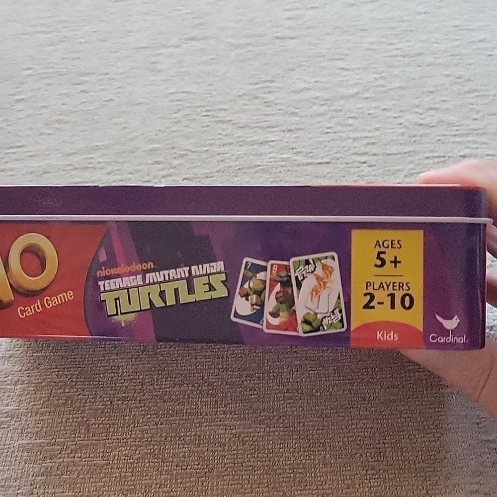 Uno Teenage Mutant Ninja Turles card game in storage tin. Great condition.